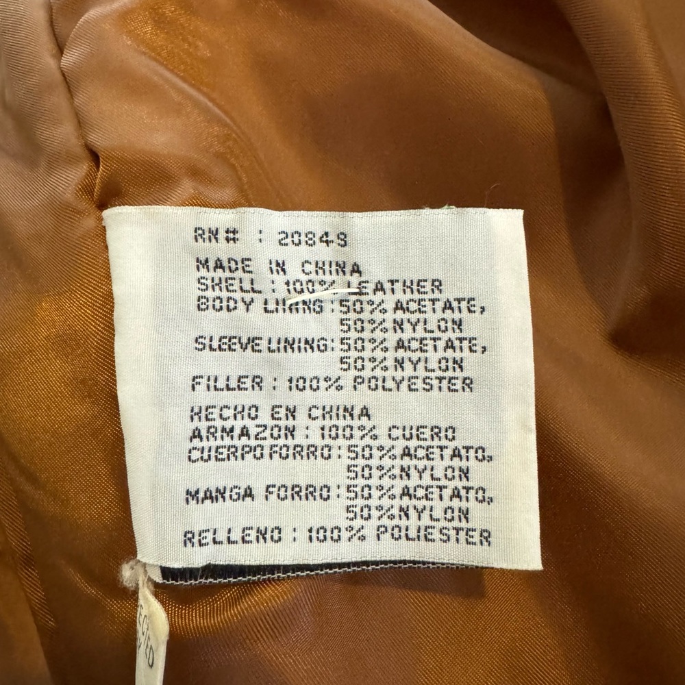 Vintage Smith & Wesson tan suede fringe jacket.